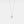 Silver necklace with a bell-shaped pendant on a light gray background