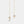 Gold bell-shaped earrings with small diamonds on a light gray background
