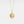 Gold necklace with a round locket featuring a fox and stars on a light gray background, inspired by 'The Little Prince'.
