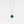 Gold locket necklace with a green malachite pendant on a light gray background