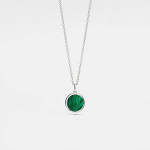 Silver locket necklace with a green malachite pendant on a light gray background