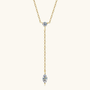 Gold necklace with a blue gemstone pendant on a white background