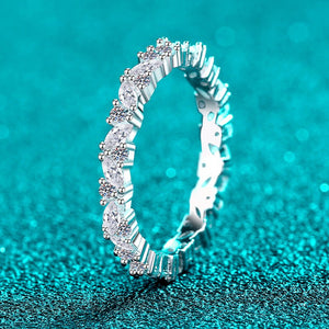 Silver ring with diamonds on a turquoise background