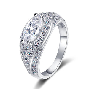 Silver ring with clear moissanite on a white background