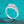 Silver ring with a large moissanite on a turquoise glittery background