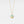 Gold necklace with a round pendant on a light gray background