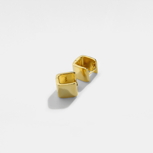 Gold square hoop earrings on a light gray background