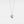 A white gold-plated locket necklace with a star design on the locket, suspended from a delicate chain.