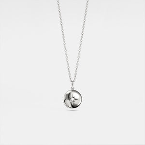 A white gold-plated locket necklace with a star design on the locket, suspended from a delicate chain.
