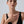 Woman wearing a black dress with a plain background