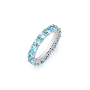 Silver ring with blue gemstones on a white background