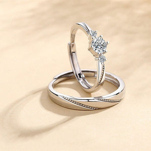 Two silver rings with diamond on a beige background
