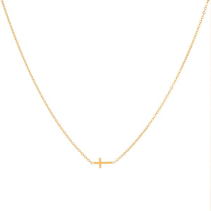 Gold necklace with a small cross pendant on a white background