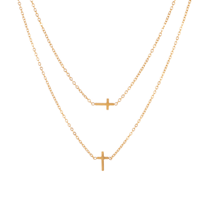 Two gold necklaces with small cross pendants on a white background