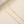 Gold chain necklace with cross pendants on a beige background