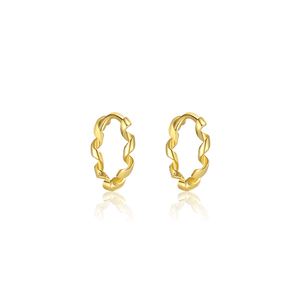Gold hoop earrings on a white background