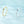 Gold and silver rings on a light blue background