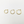 Three gold hoop earrings on a light gray background
