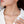 Pearl necklace worn by a model with a blurred background