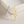 Gold and silver star-shaped earrings on a light background