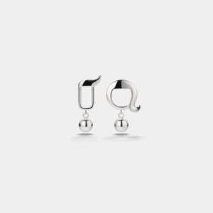 Pair of silver earrings on a light gray background