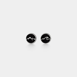 Pair of black and silver earrings on a white background