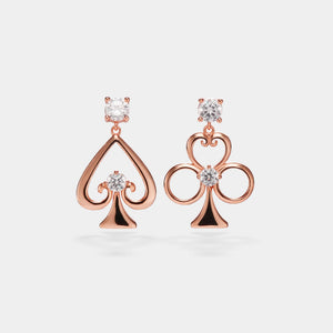 Rose gold earrings with diamond accents on a light gray background