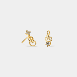 Gold earrings with musical note design on a light gray background