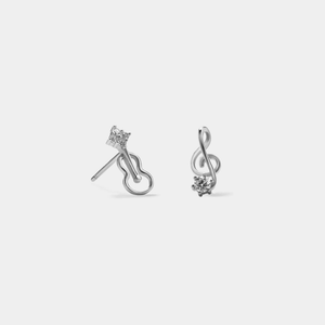 A pair of stud earrings featuring a musical note design with gold plating and cubic zirconia.