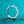 Silver ring with diamonds on a teal glitter background