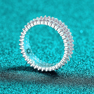 Silver ring with diamonds on a turquoise glitter background