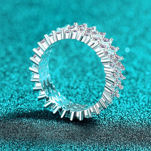 Silver ring with diamonds on a turquoise glitter background