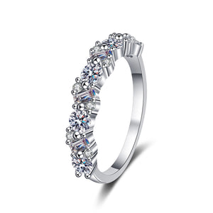 Silver ring with multiple gemstones on a white background