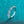 Silver ring with diamonds on a teal background