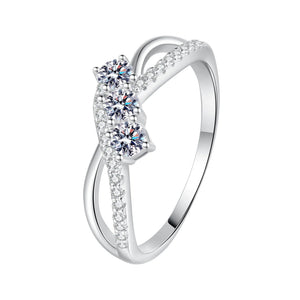 Silver ring with diamond accents on a white background