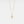 Gold heart-shaped pendant necklace on a light gray background