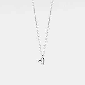 Silver heart-shaped pendant necklace on a white background