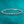 Rose gold bracelet with diamonds on a teal background