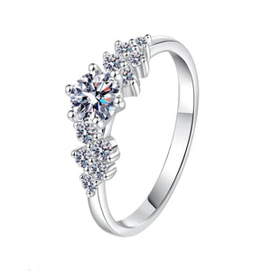Silver ring with multiple gemstones on a white background