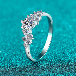 Silver ring with diamonds on a turquoise background