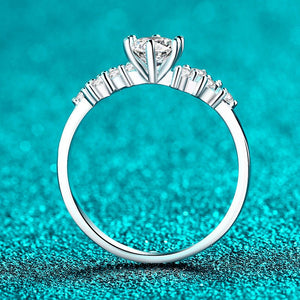 Silver ring with a diamond on a turquoise background