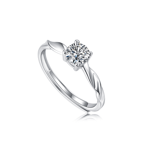 Silver ring with a diamond on a white background