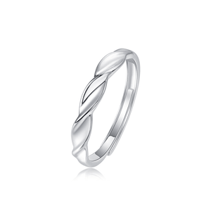 Silver ring with a twisted design on a white background