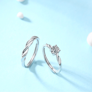 Two silver rings on a light blue background