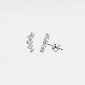 Pair of silver earrings on a light gray background