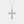 Silver cross necklace with diamonds on a light gray background