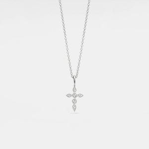 Silver cross pendant necklace on a light gray background