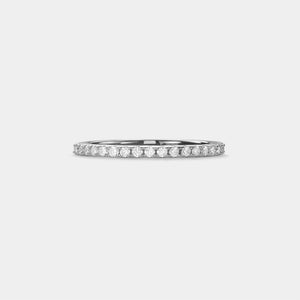 Diamond ring on a light gray background