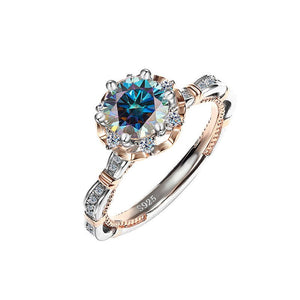 A collection of six moissanite cocktail rings with floral designs, displayed against a white background. The rings feature a variety of colors including blue, yellow, and red, with a hypoallergenic silver finish.