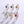 Set of six earrings with colorful gemstones on a light gray background